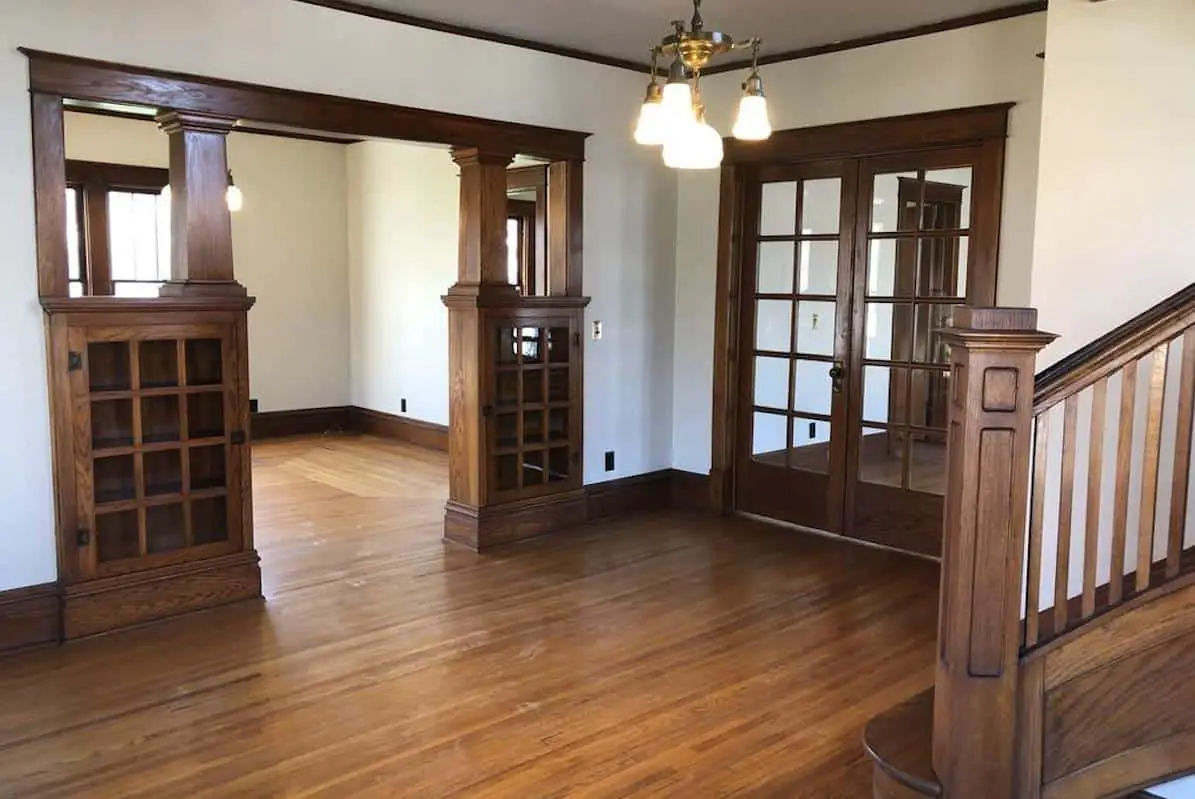 Photo of the interior of an American Foursquare home with built in Craftsman oak cabinets. 