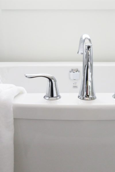 white bathtub and faucet