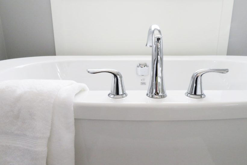 white bathtub and faucet