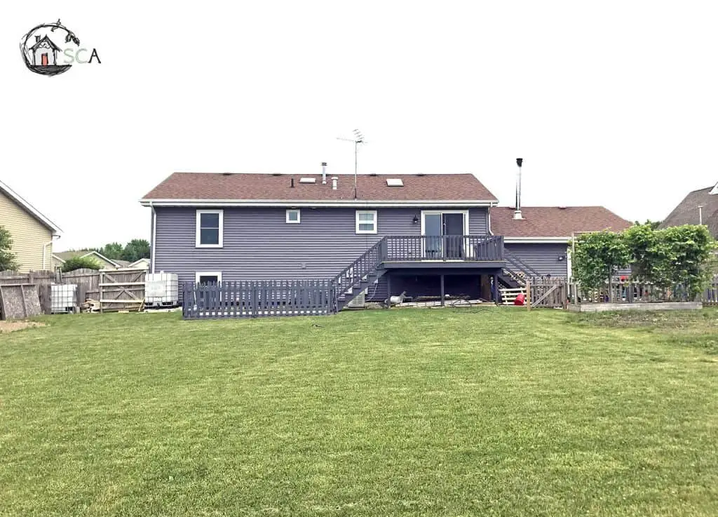 backyard of a grey house 