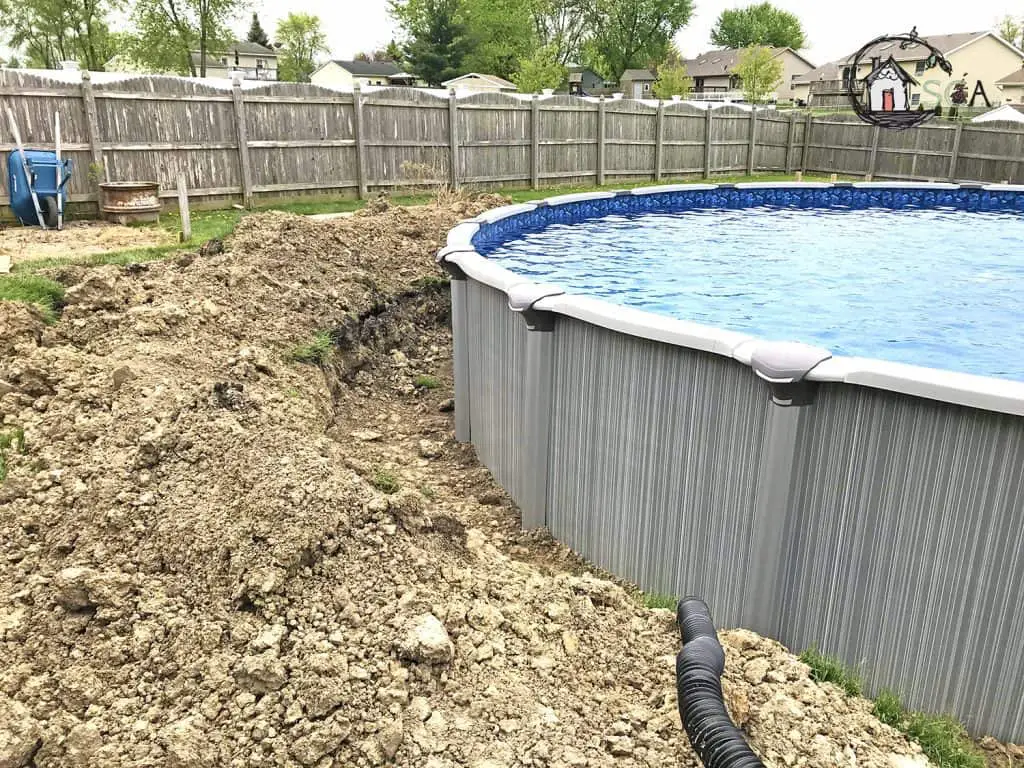 How to Choose an Above Ground Pool for Your Backyard 3 excavated dirt around a pool