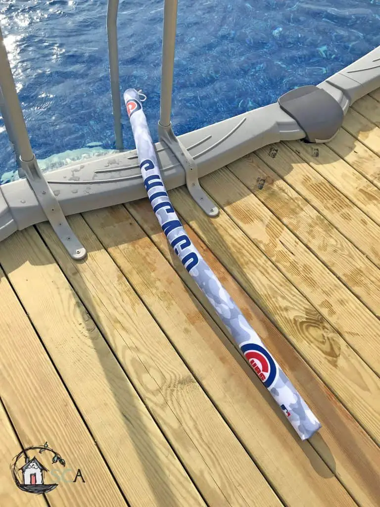 Chicago Cubs pool noodle on a wood deck