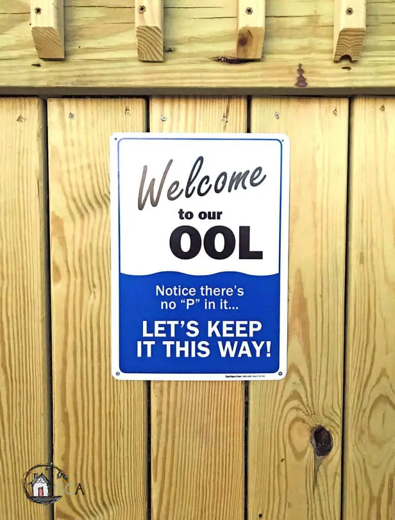 sign on a wood background - welcome to our ool