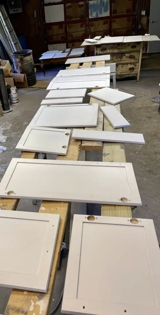 How to Paint Kitchen Cabinets that are Stained 19 back of cabinets doors after priming