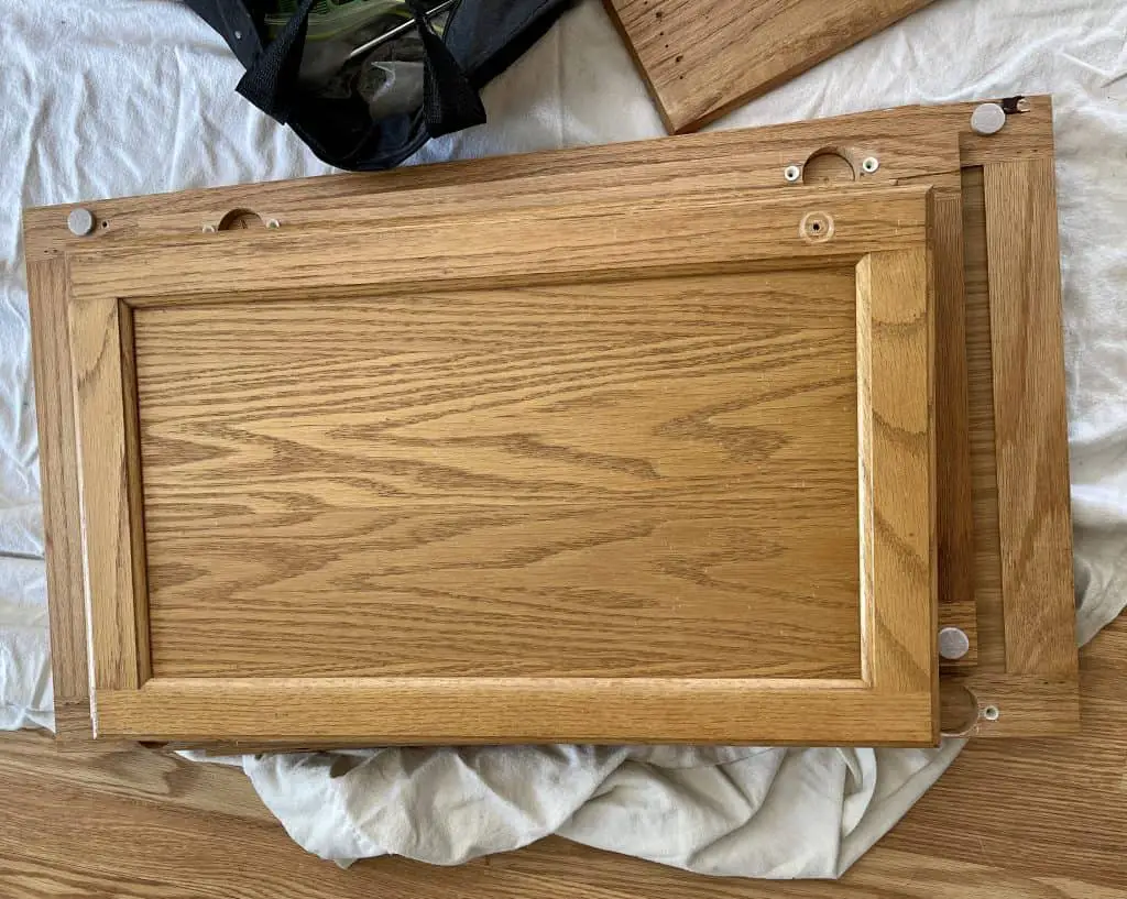 How to Paint Kitchen Cabinets that are Stained 9 cabinet doors with hardware removed